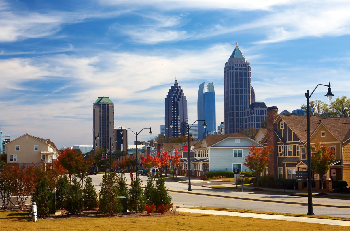 street and houses with Atlanta, Georgia skyline